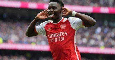 Arsenal withstand Tottenham’s second-half fightback to boost title hopes