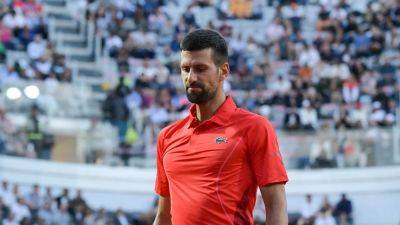 Novak Djokovic injured after bottle falls on his head while signing autographs