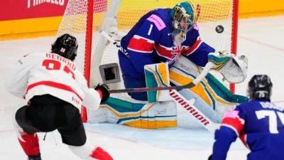 Connor Bedard scores pair in hockey worlds debut to lead Canada past Great Britain