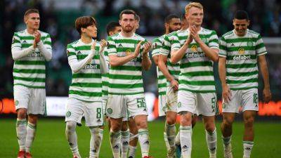 Celtic beat 10-man Rangers to virtually seal Scottish title