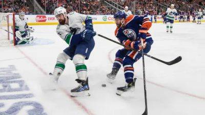 Bouchard scores late as Oilers even series with 3-2 win over Canucks
